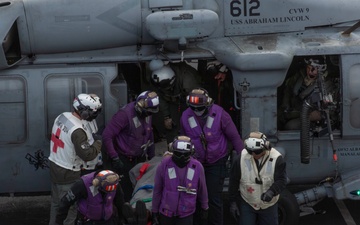 Sailors participate in a medical emergency drill aboard Abraham Lincoln