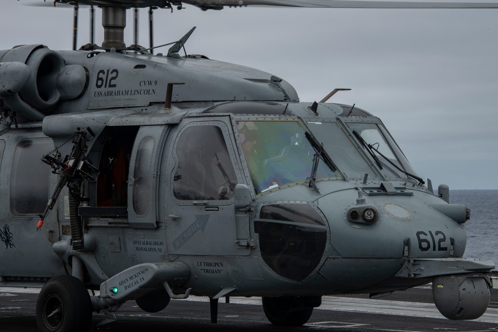 Capt. Pete Riebe participates in helicopter operations aboard Abraham Lincoln