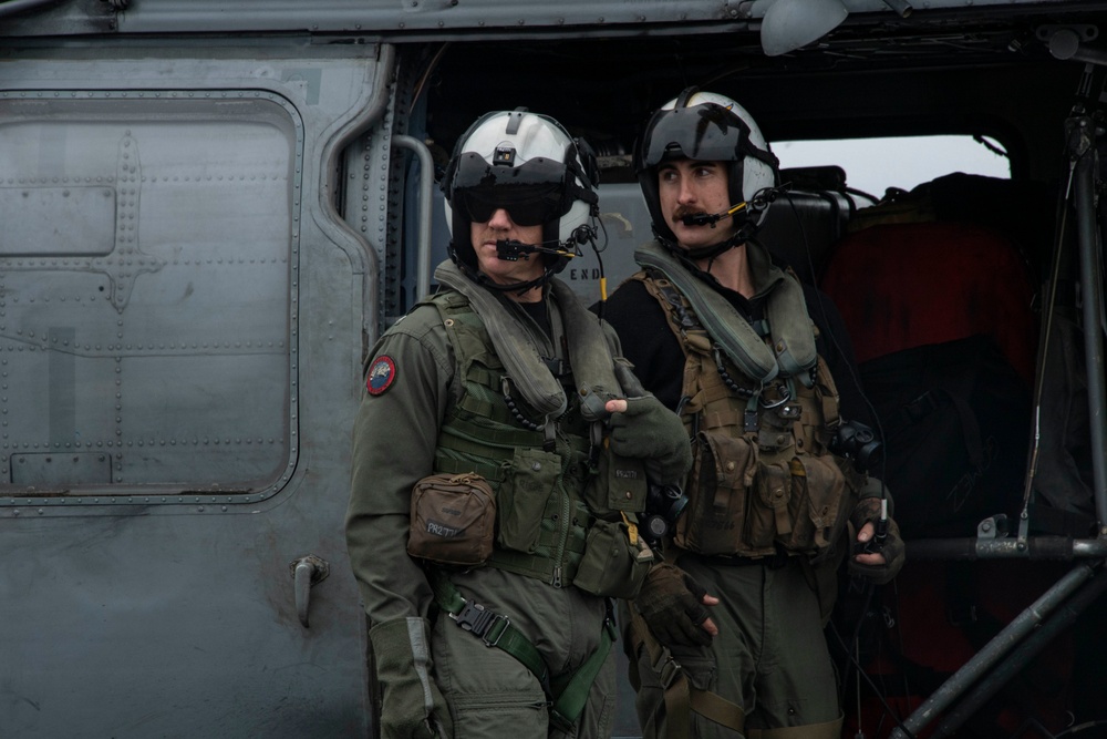 Capt. Pete Riebe participates in helicopter operations aboard Abraham Lincoln