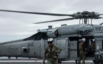 Capt. Pete Riebe participates in helicopter operations aboard Abraham Lincoln