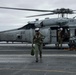 Capt. Pete Riebe participates in helicopter operations aboard Abraham Lincoln