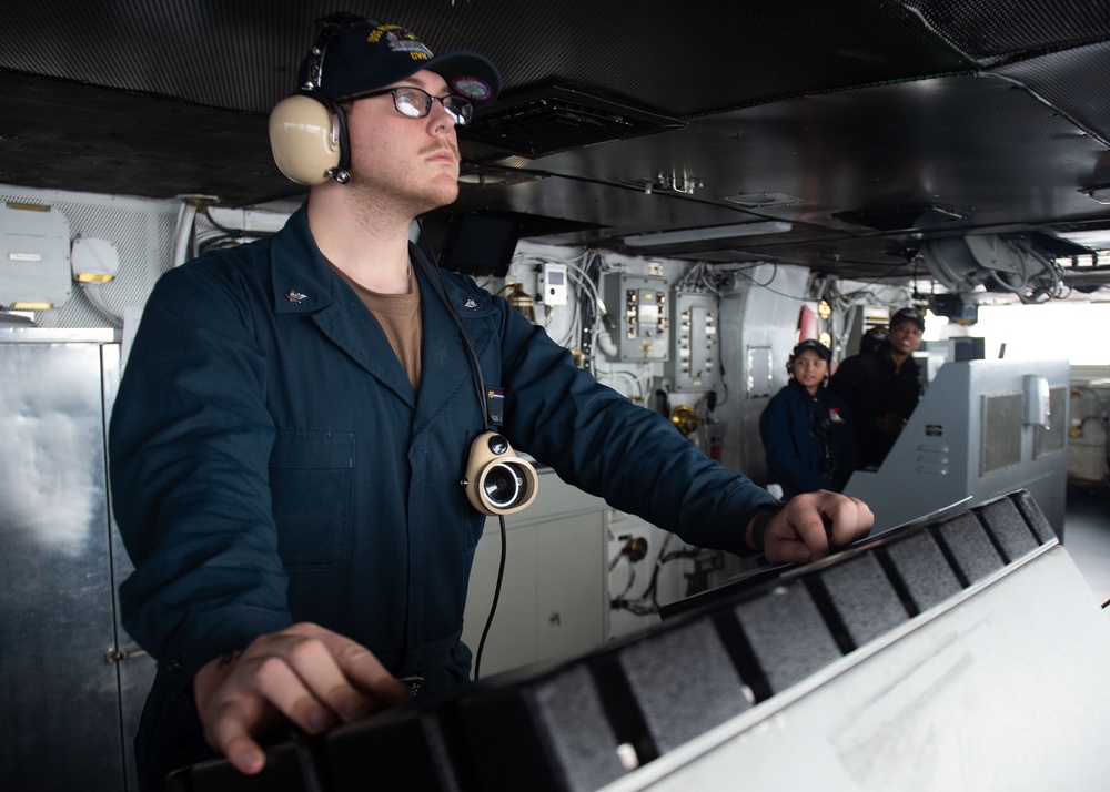 USS Ronald Reagan (CVN 76) Sailors stand watch in the pilot house