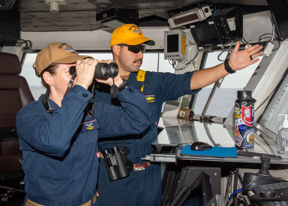 USS Ronald Reagan (CVN 76) Sailors stand watch in the pilot house