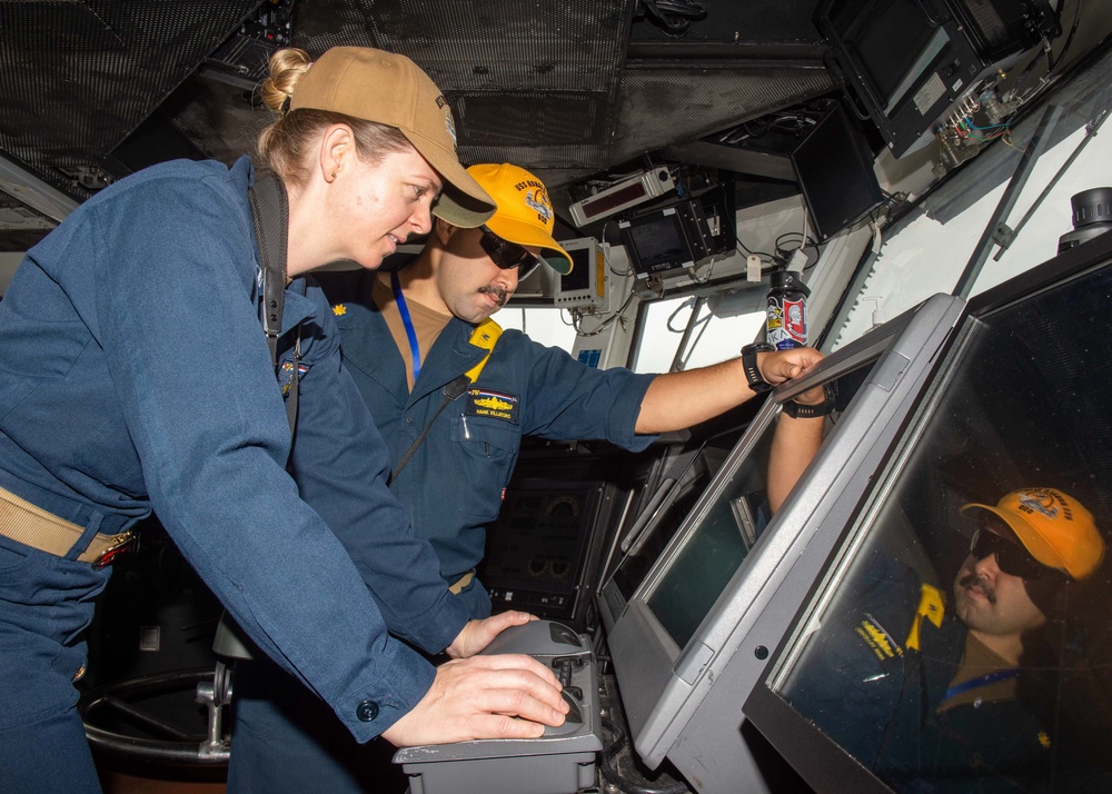 USS Ronald Reagan (CVN 76) Sailors stand watch in the pilot house