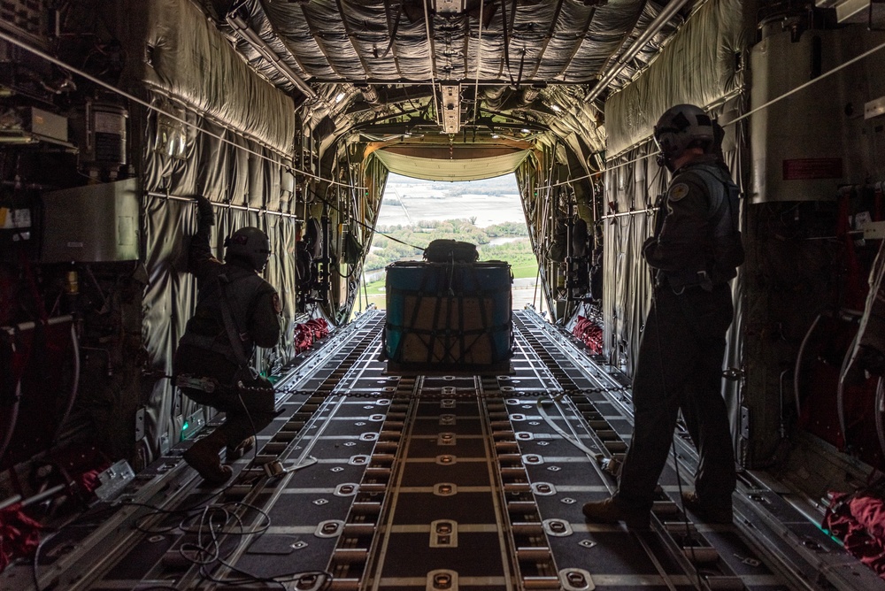 C-130H Hercules loadmasters monitor an airdrop during a training sortie April 30, 2024