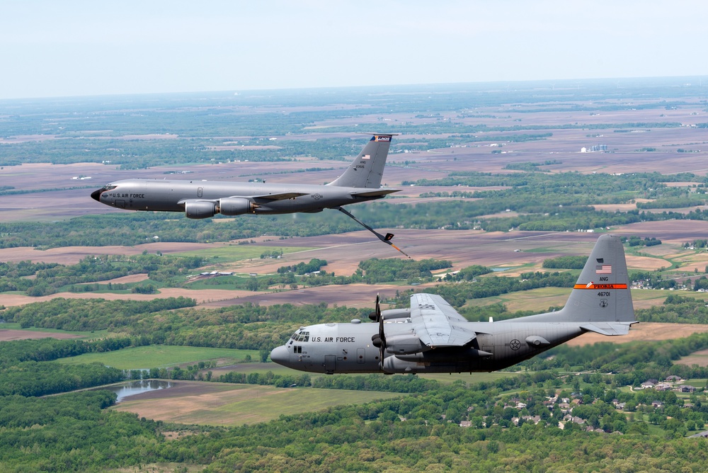 Illinois Air National Guard C-130H Hercules and KC-135R Stratotanker fly over Springfield, Ill., May 1, 2024