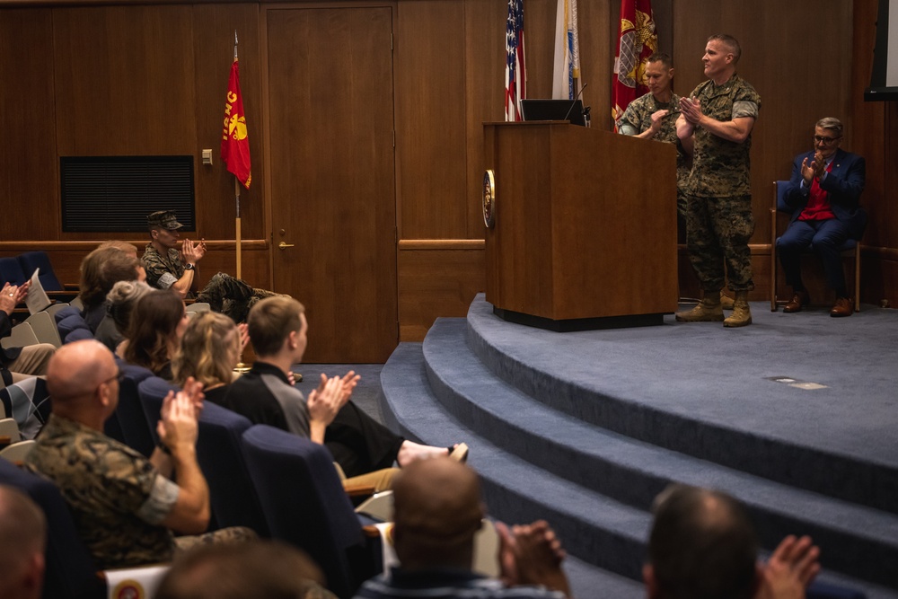 U.S. Marines with MCOTEA host a change of command ceremony