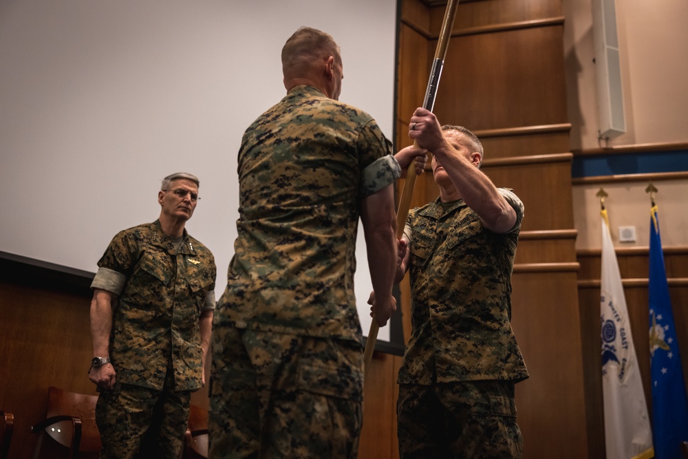 U.S. Marines with MCOTEA host a change of command ceremony