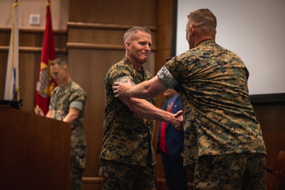 U.S. Marines with MCOTEA host a change of command ceremony