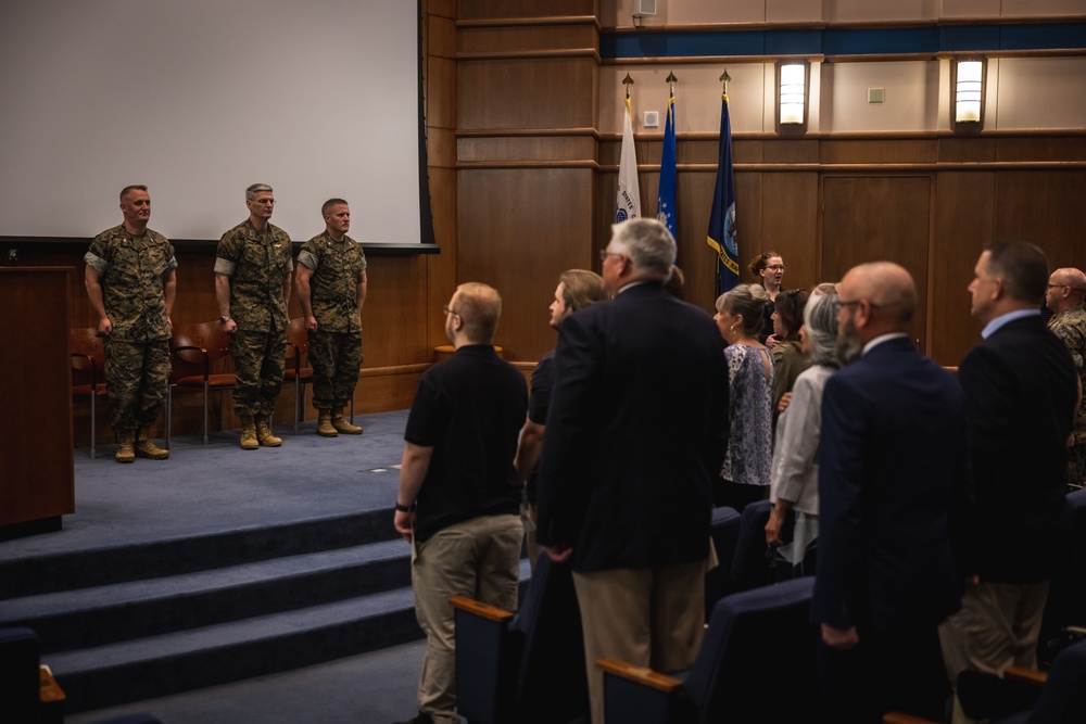 U.S. Marines with MCOTEA host a change of command ceremony