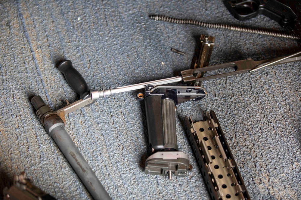 USS Ralph Johnson Sailors Conduct M240B Maintenance