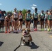 MCRD San Diego Mascot Pfc. Bruno poses with pro race runners at BOLDERboulder10k