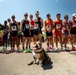 MCRD San Diego Mascot Pfc. Bruno poses with pro race runners at BOLDERboulder10k