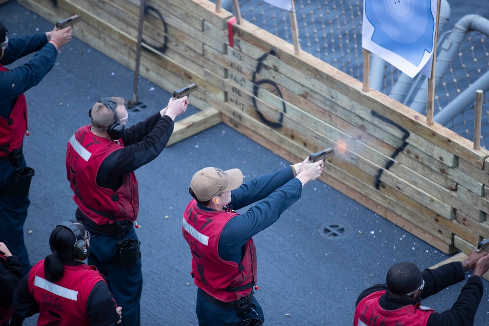 USS Tripoli Sailors participate in a gun shoot