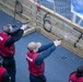 USS Tripoli Sailors participate in a gun shoot