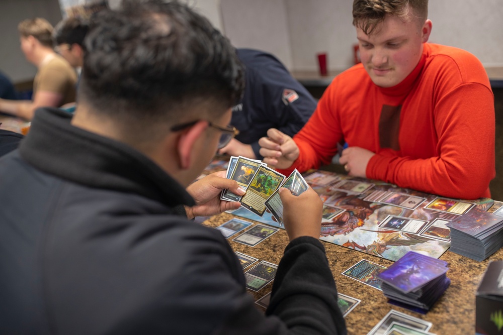 USS Tripoli Sailors play cards
