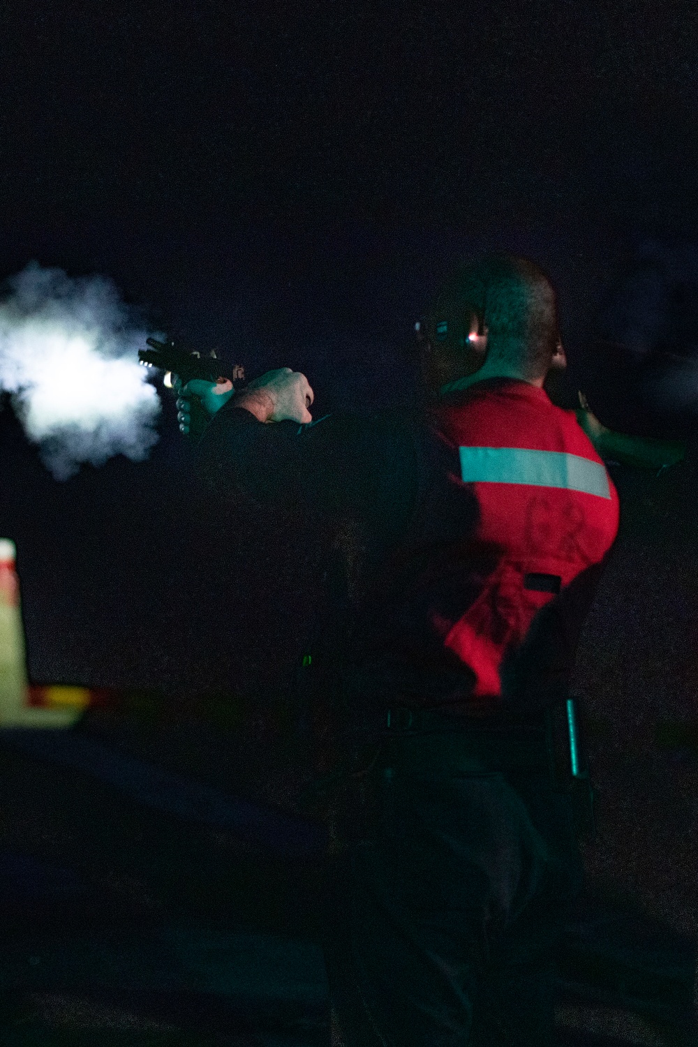 USS Tripoli Sailors practice with the M18 pistol