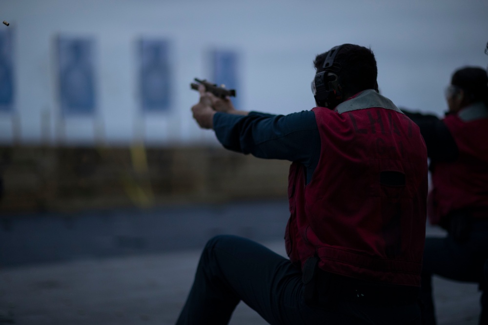 USS Tripoli Sailors practice with the M18 pistol