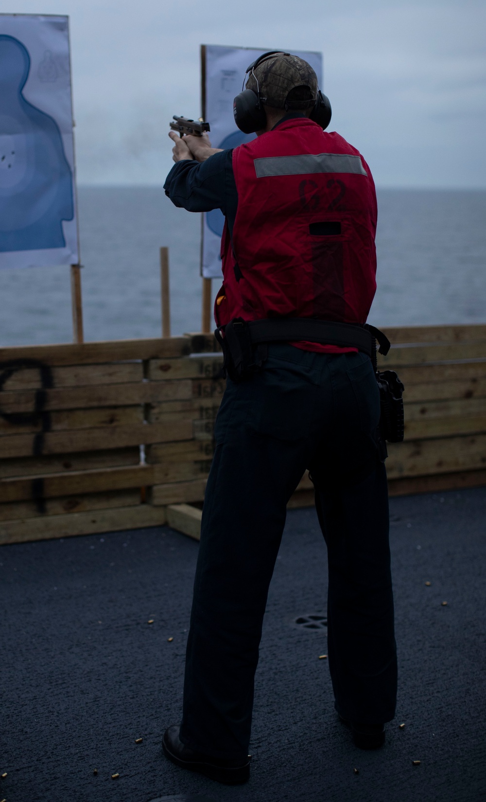 USS Tripoli Sailors practice with the M18 pistol
