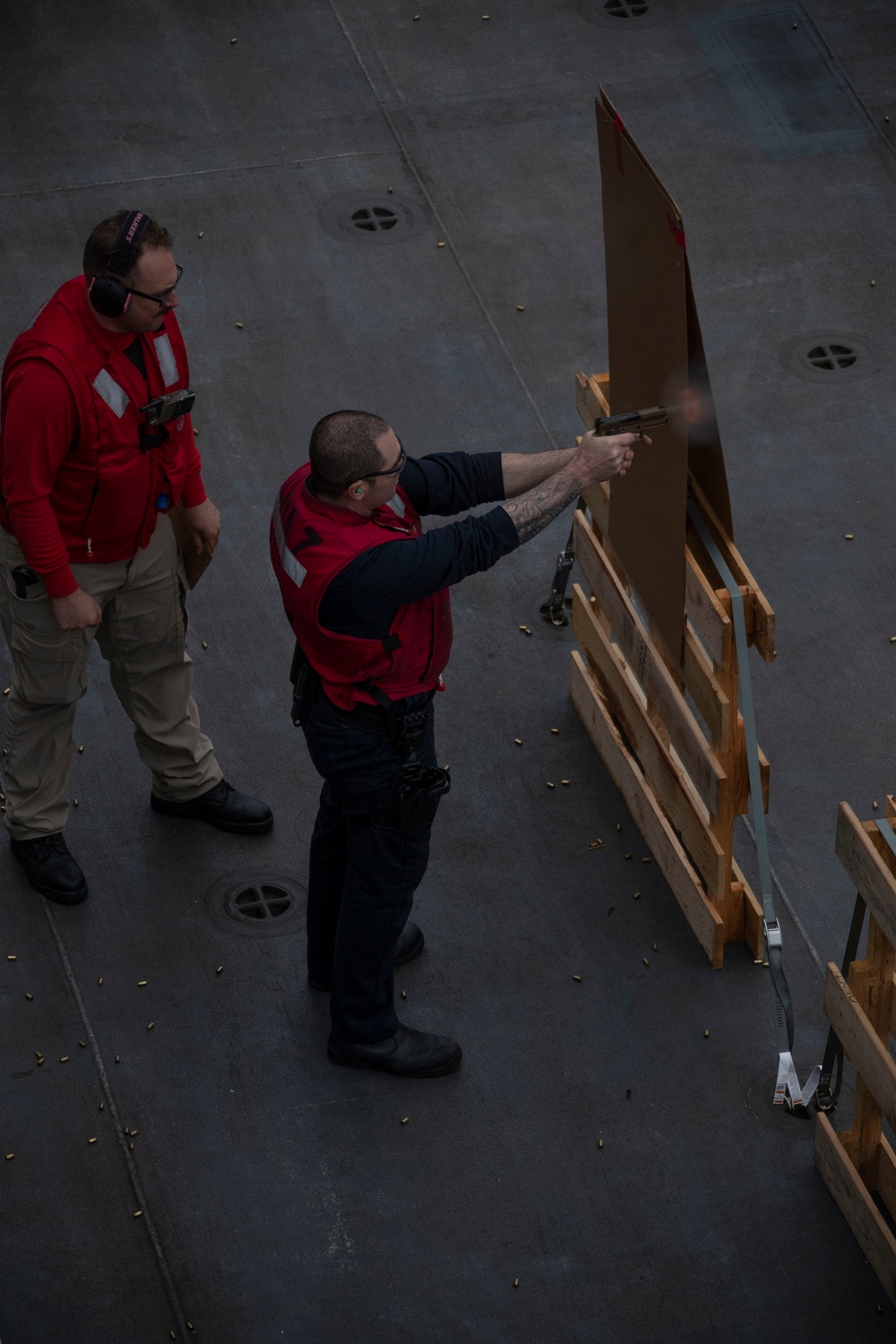 USS Tripoli Sailors practice with the M18 pistol