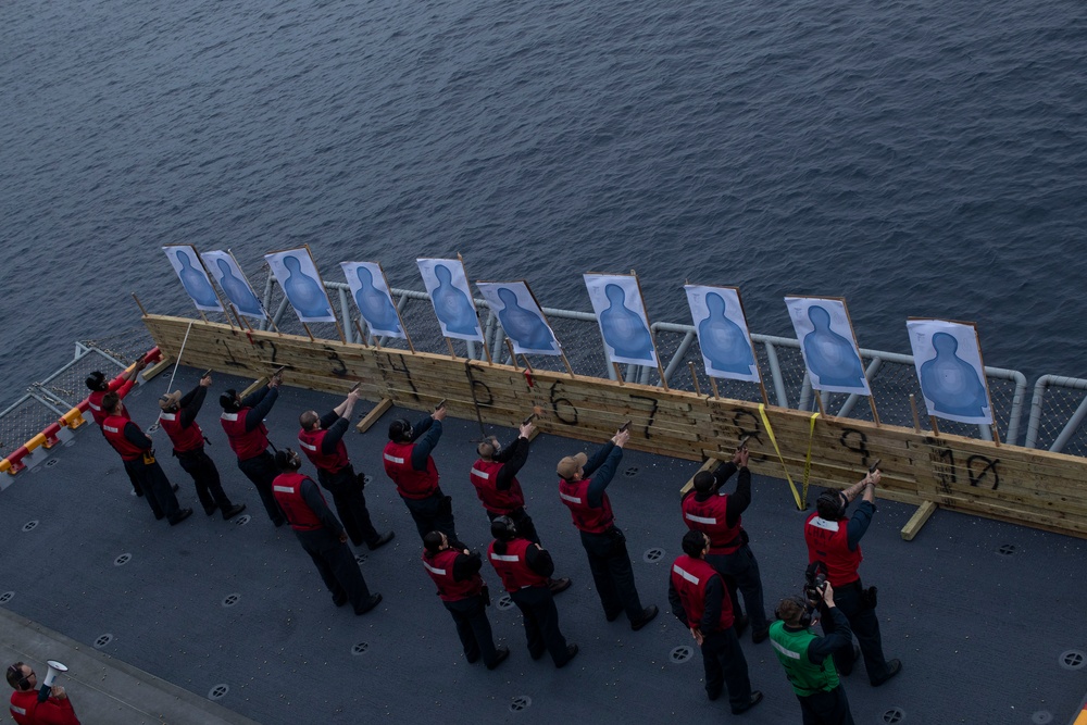 USS Tripoli Sailors practice with the M18 pistol