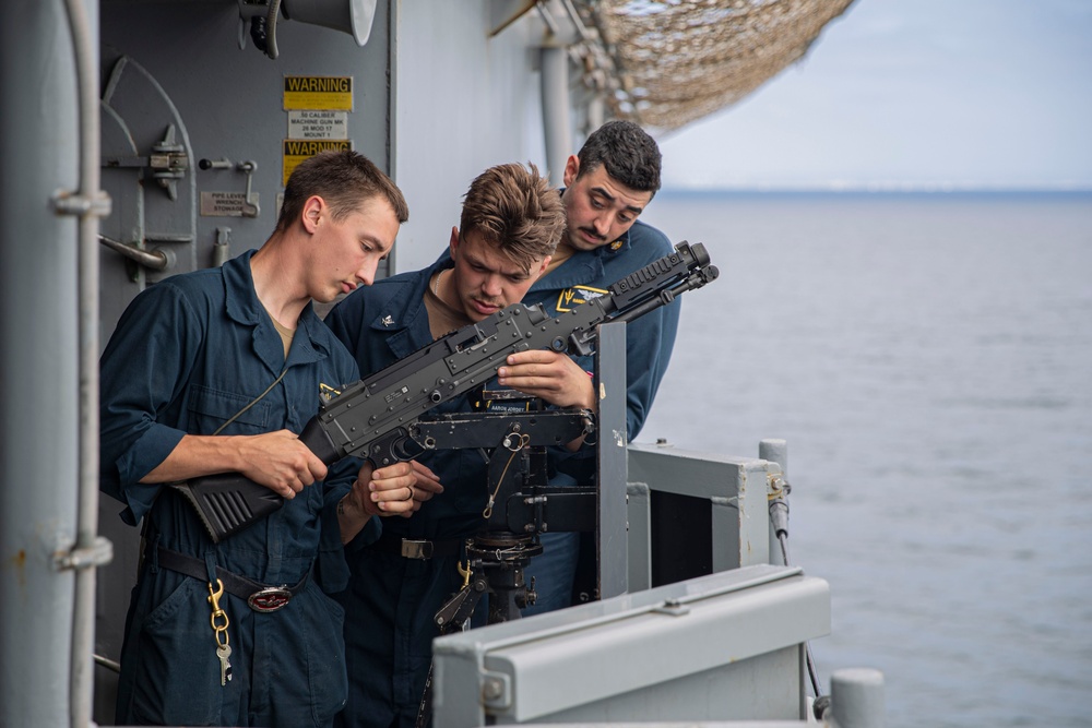 USS Tripoli Sailor practice with the M240B