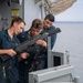 USS Tripoli Sailor practice with the M240B