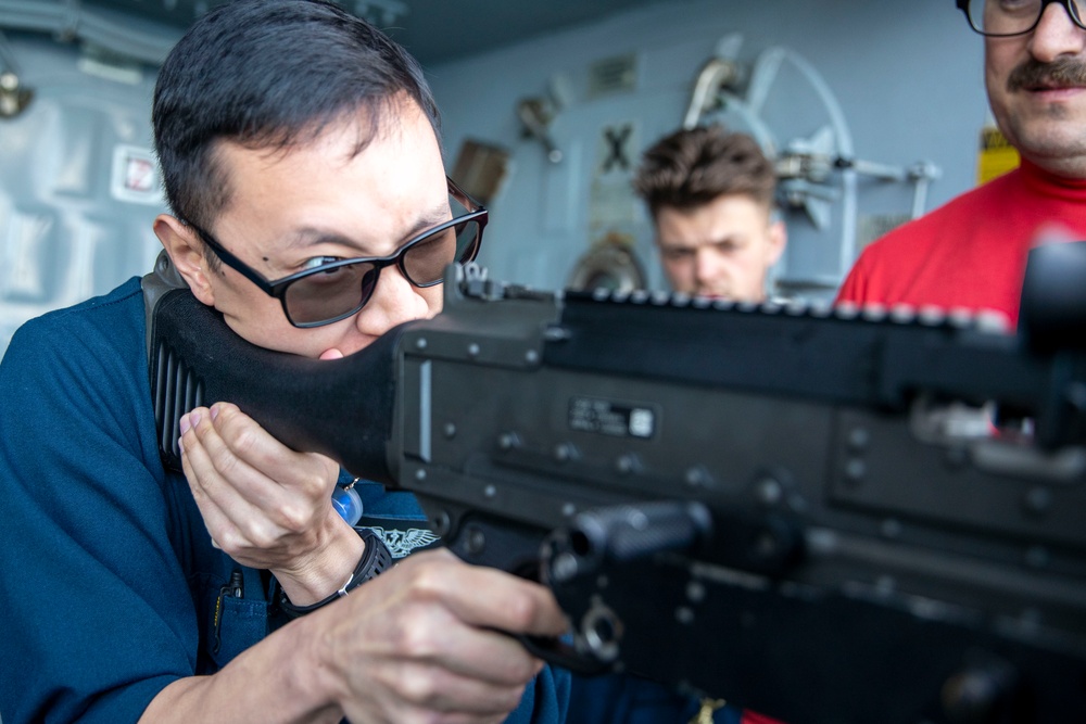 USS Tripoli Sailor practice with the M240B