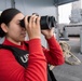 USS Tripoli Sailors stand aft lookout watch