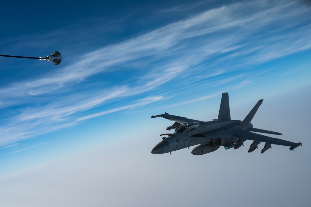 KC-135 refuels U.S. Navy Fighters in U.S. Central Command