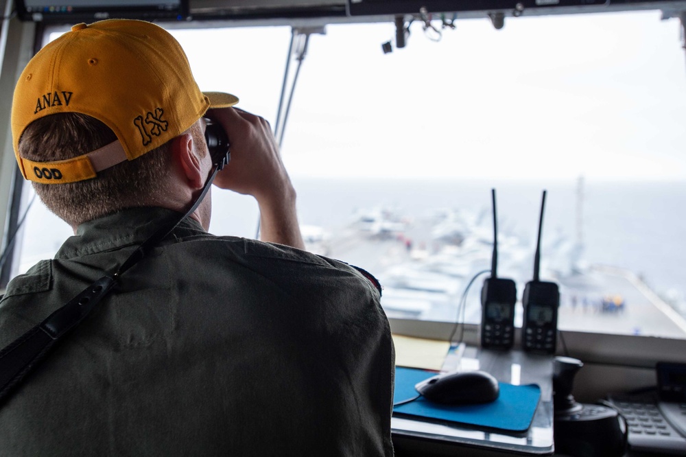 USS Ronald Reagan (CVN 76) Sailors stand watch in the pilot house