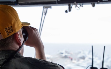 USS Ronald Reagan (CVN 76) Sailors stand watch in the pilot house