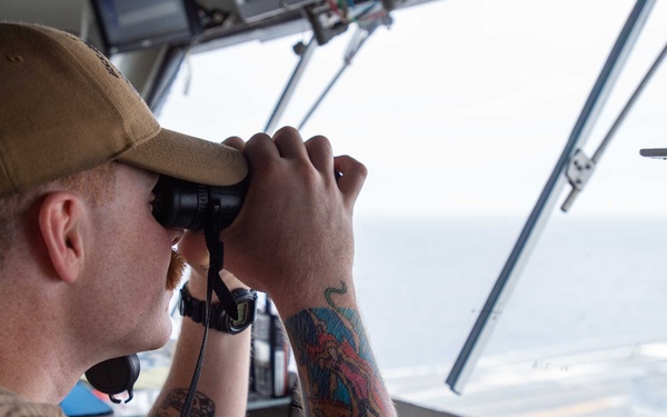 USS Ronald Reagan (CVN 76) Sailors stand watch in the pilot house