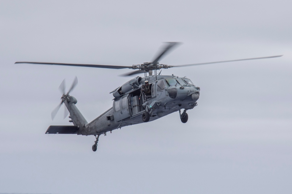 Capt. Pete Riebe participates in helicopter operations aboard Abraham Lincoln