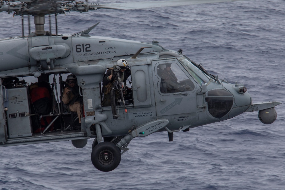 Capt. Pete Riebe participates in helicopter operations aboard Abraham Lincoln