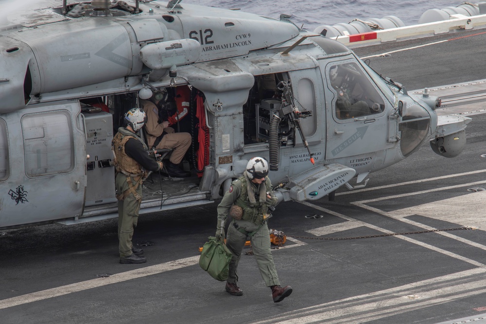 Capt. Pete Riebe participates in helicopter operations aboard Abraham Lincoln