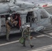 Capt. Pete Riebe participates in helicopter operations aboard Abraham Lincoln