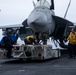Sailors transport an aircraft aboard Abraham Lincoln