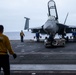 Sailors transport an aircraft aboard Abraham Lincoln