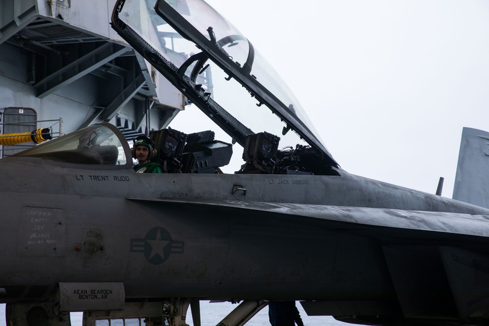 Sailor brake rides an aircraft aboard Abraham Lincoln