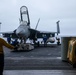 Sailors transport an aircraft aboard Abraham Lincoln