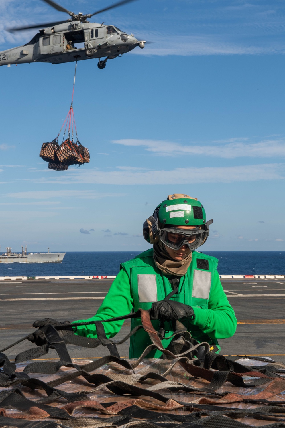 USS Ronald Reagan (CVN 76) conducts a vertical replenishment-at-sea with USNS John Ericsson (T-AO 194)
