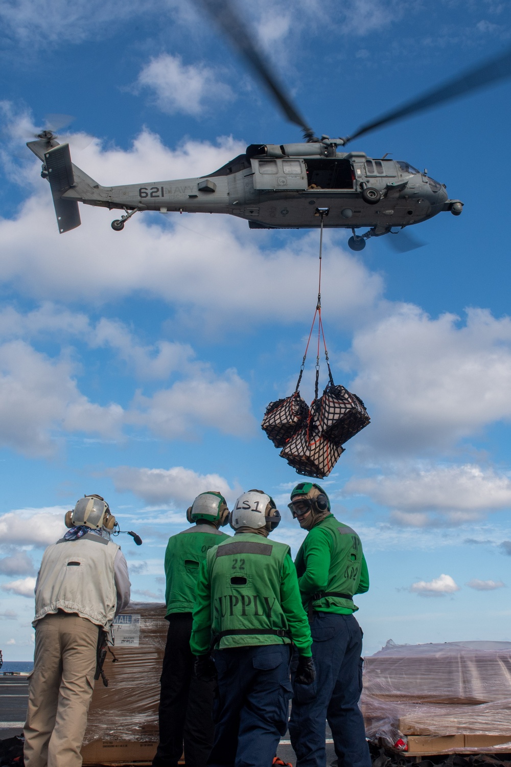 USS Ronald Reagan (CVN 76) conducts a vertical replenishment-at-sea with USNS John Ericsson (T-AO 194)
