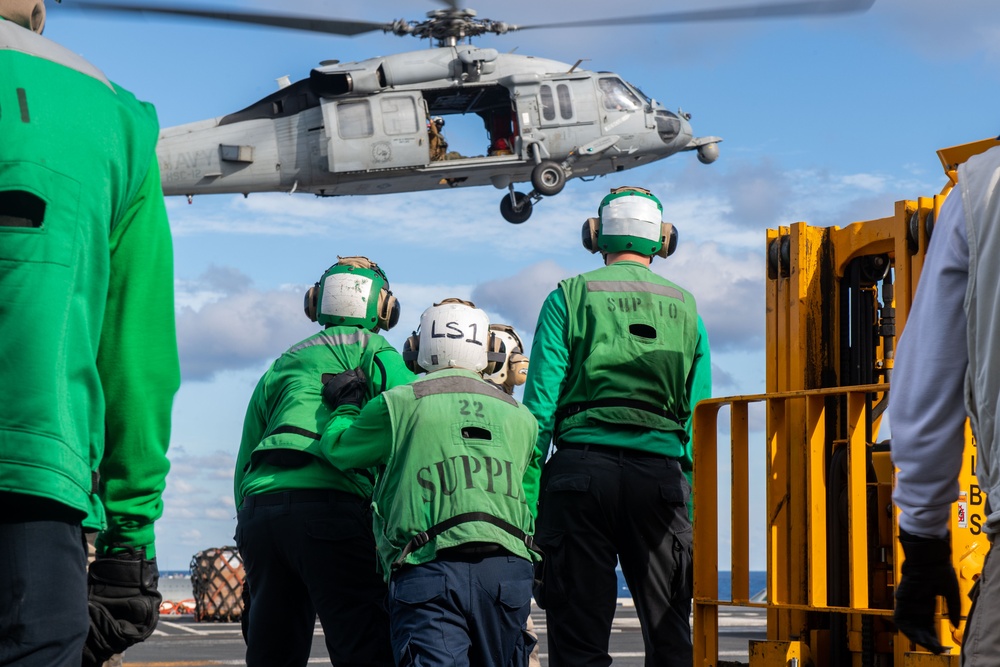 USS Ronald Reagan (CVN 76) conducts a vertical replenishment-at-sea with USNS John Ericsson (T-AO 194)