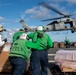 USS Ronald Reagan (CVN 76) conducts a vertical replenishment-at-sea with USNS John Ericsson (T-AO 194)