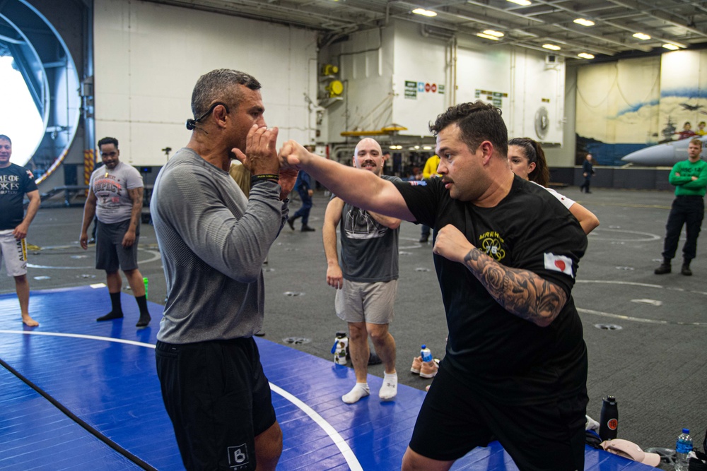 USS Ronald Reagan (CVN 76) Sailors participate  in a fitness session with Vitor Belfort