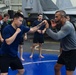 USS Ronald Reagan (CVN 76) Sailors participate  in a fitness session with Vitor Belfort