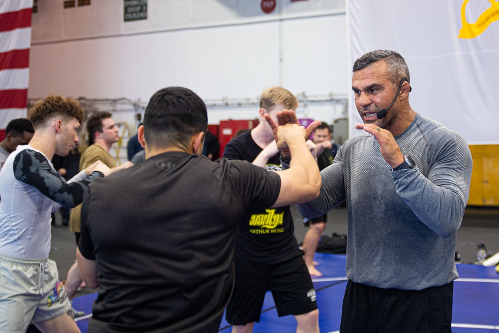 USS Ronald Reagan (CVN 76) Sailors participate  in a fitness session with Vitor Belfort