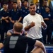 USS Ronald Reagan (CVN 76) Sailors warm up before a fitness session with Vitor Belfort