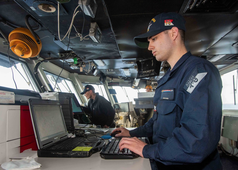 USS Ronald Reagan (CVN 76) Sailors stand watch in the pilot house